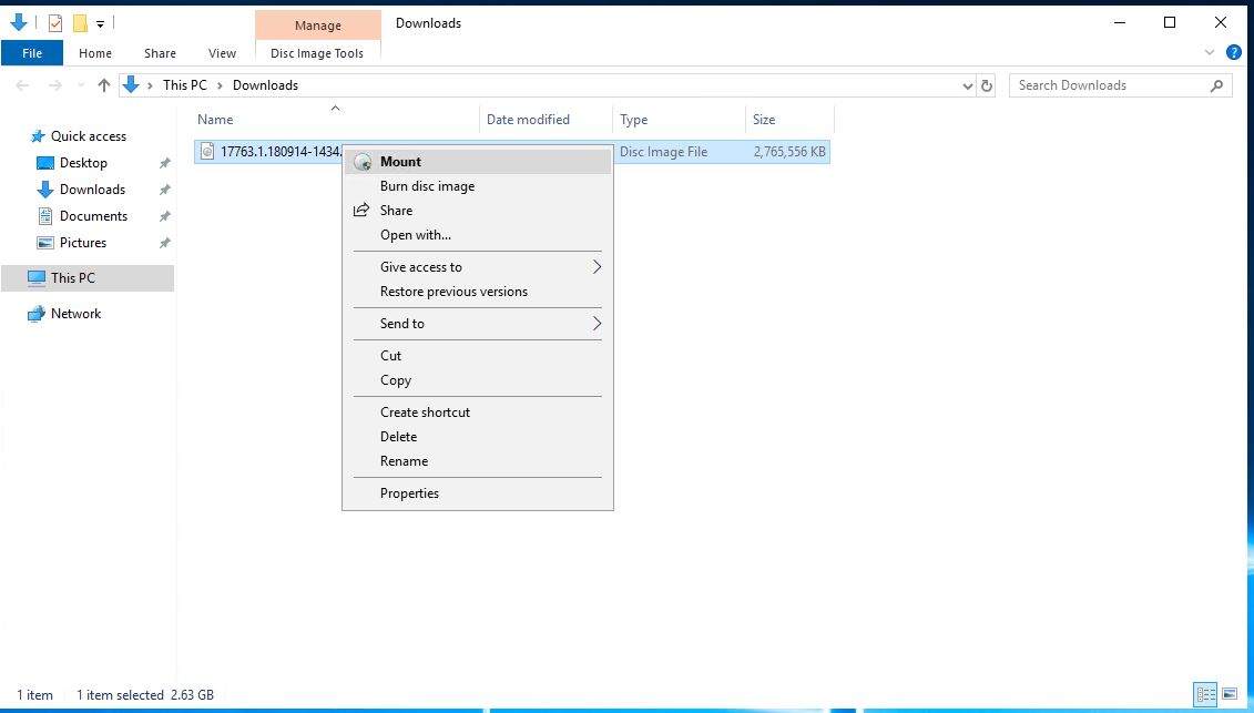 File Explorer showing the downloaded Windows Server 2019 language pack ISO file.